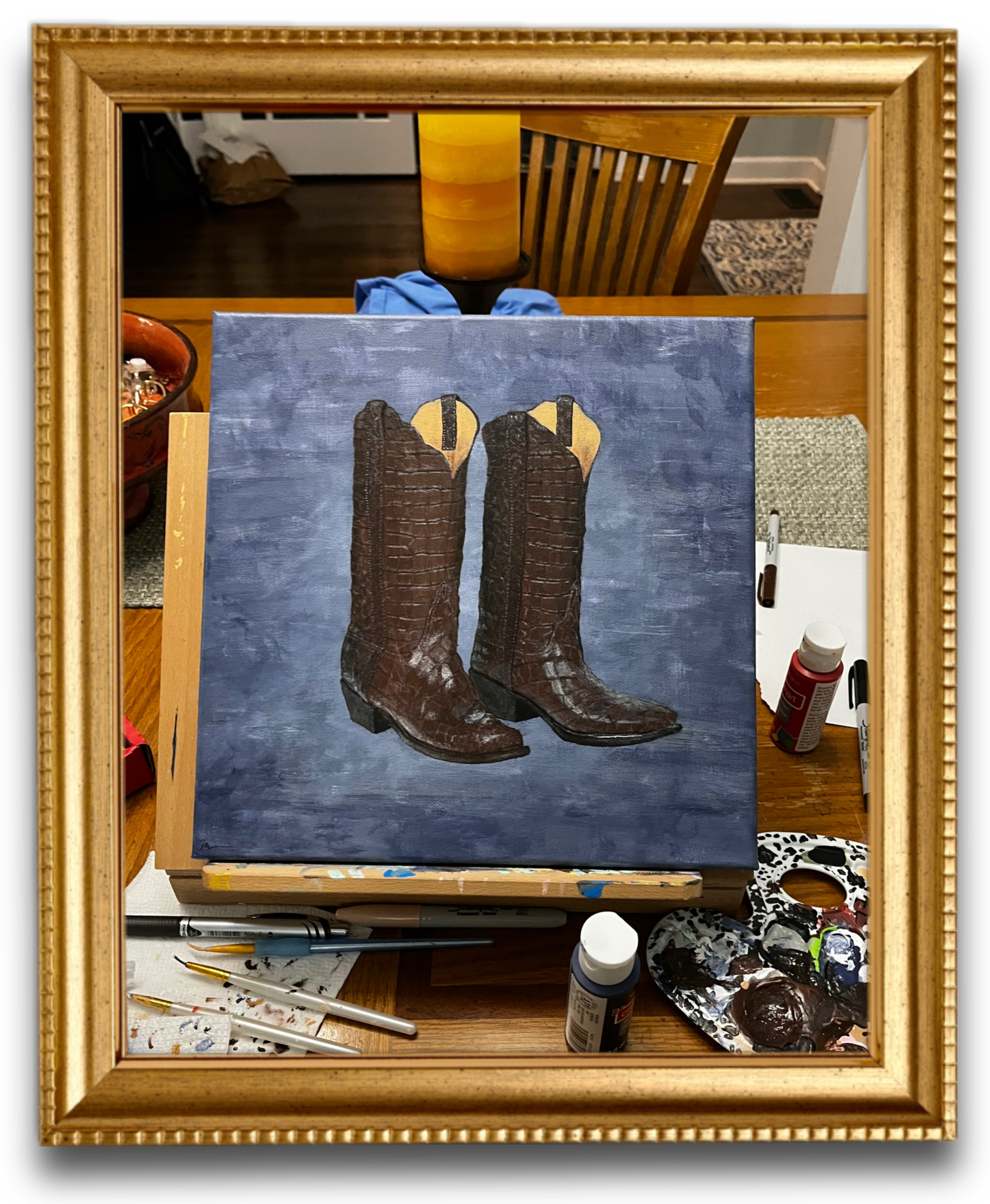 A beautiful painting of brown cowboy boots over a blue abstract background
